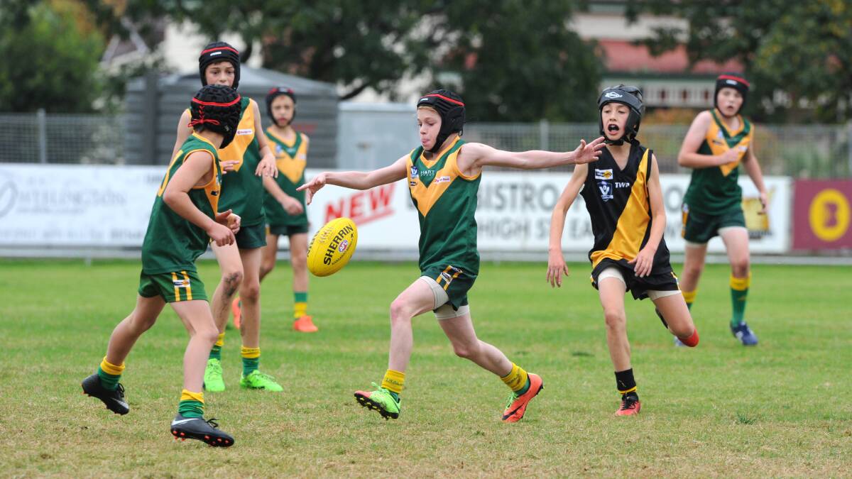 Action from the St Kilian's-St Peter's versus Kyneton under-12B clash at Weeroona Oval. Picture: NONI HYETT