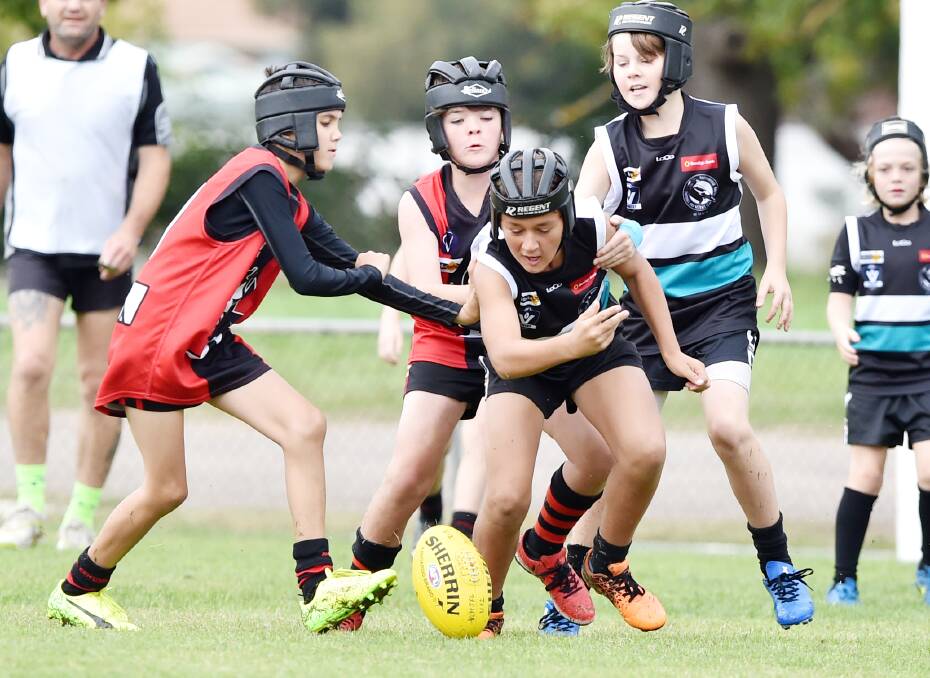 EYES ON THE BALL: Action from the White Hills versus Maryborough under-12 game at Scott Street on Sunday. The Magpies proved too strong for the Demons. Picture: DARREN HOWE