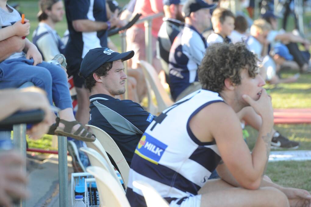 WOUNDED WARRIOR: Strathfielldsaye Storm star Sam Heavyside on the sidelines after injuring his hamstring in the first half against Sandhurst. Picture: ADAM BOURKE