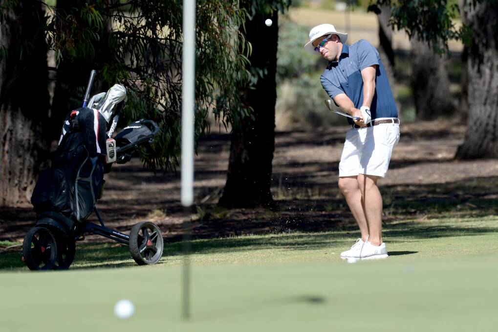 BIRDIE BLITZ: Andrew Martin plays his second shot to the par-four second hole at the Neangar Park Pro-Am on Friday. Picture: DARREN HOWE