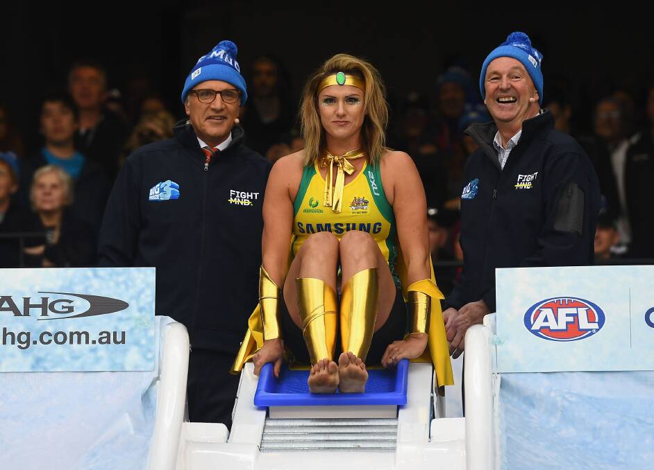 Sharelle McMahon goes down the Freeze MND slide at the MCG. Picture: GETTY IMAGES