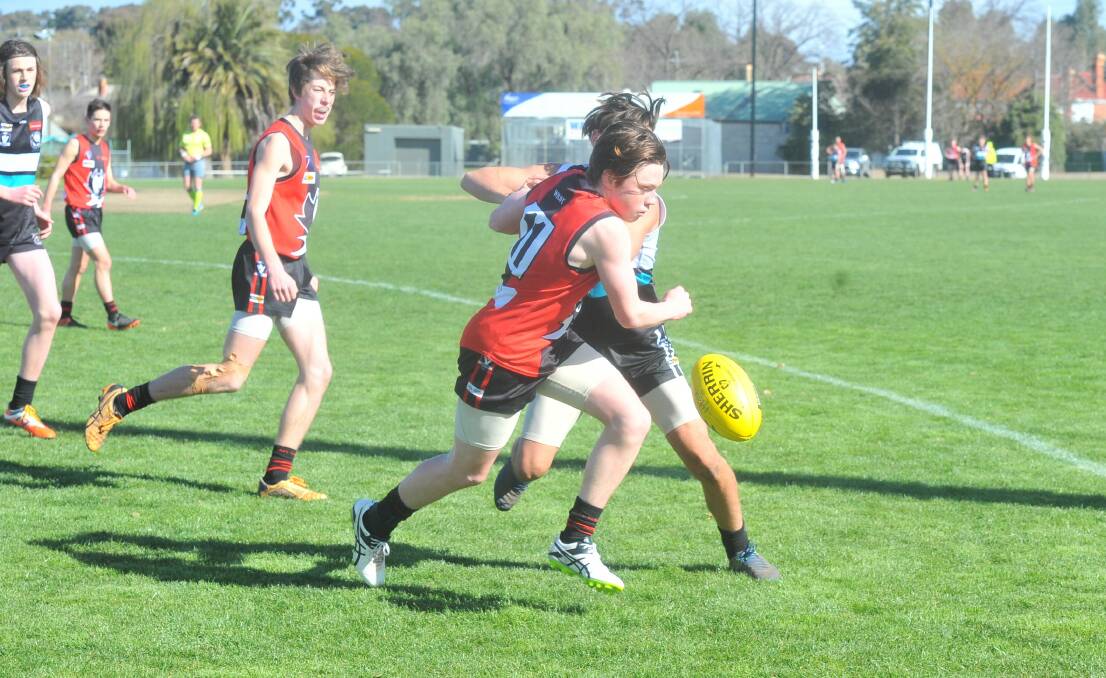 IN FRONT: WHite Hills' Blair Boyd leads the race for the ball in the under-16 reserves first semi-final against Maryborough.