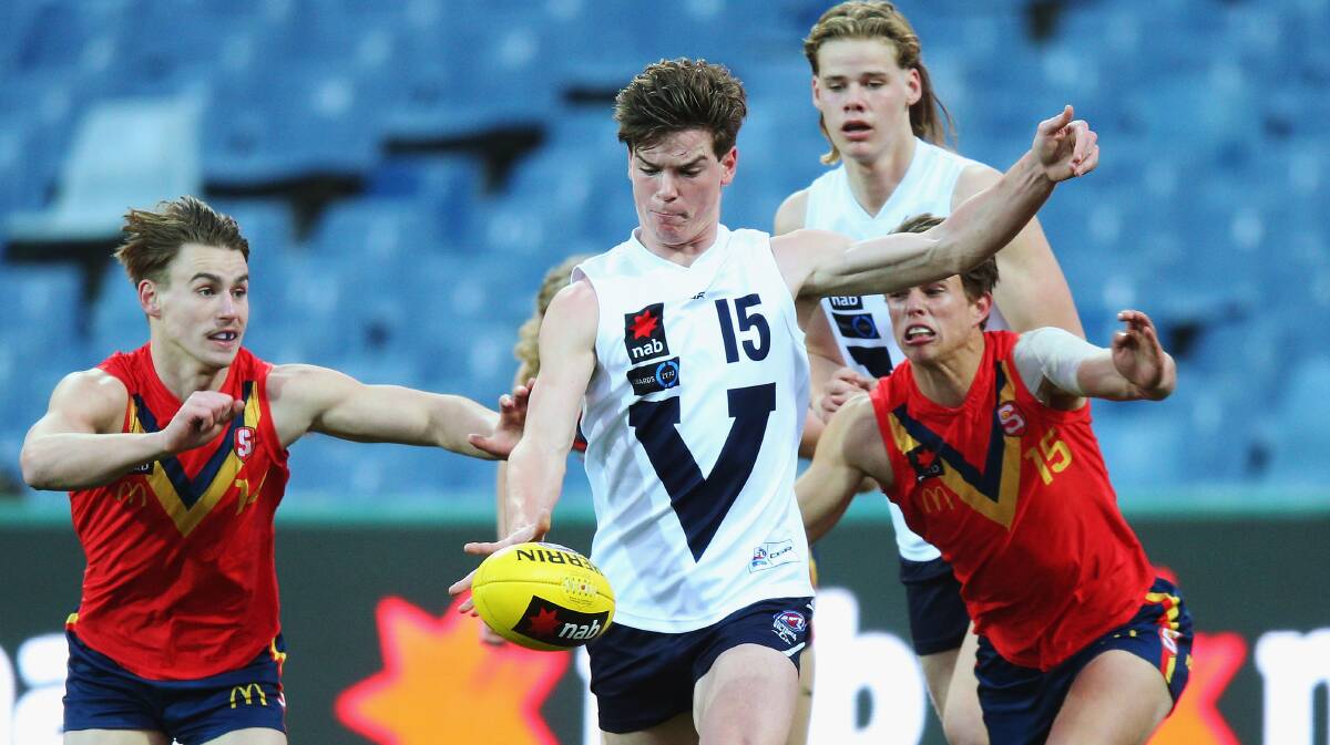 BALL MAGNET: Paddy Dow gets a kick away for Vic Country against South Australia. Picture: GETTY IMAGES