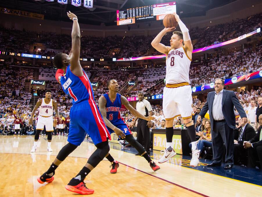 COUNT IT: Dellavedova drains a three-pointer for the Cavs against Detroit in the NBA play-offs. Picture: GETTY IMAGES