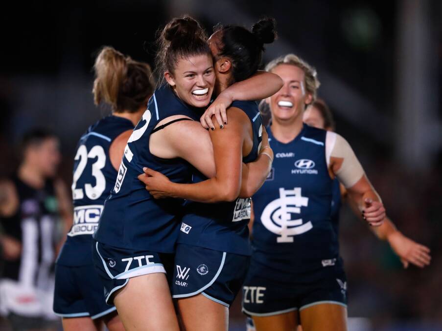 Bendigo Thunder's Bell Ayre gives her Carlton team-mate Darcy Vescio a big hug after one of her four goals. Picture: GETTY IMAGES