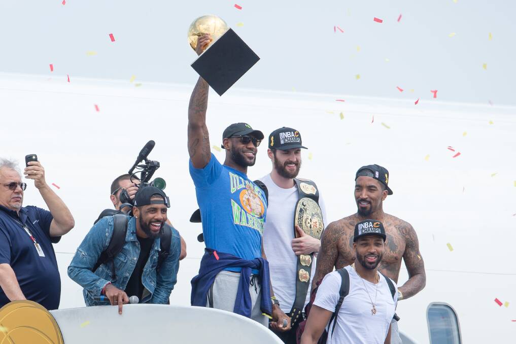 LeBron James shows off the Larry O'Brien Trophy to Cavs' fans. Picture: GETTY IMAGES