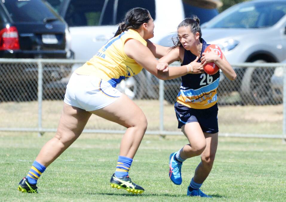 ELUSIVE: Bendigo Pioneers' Loree Newton tries to break a tackle in Saturday's TAC Cup girls under-18 clash with the Western Jets. Picture: DARREN HOWE
