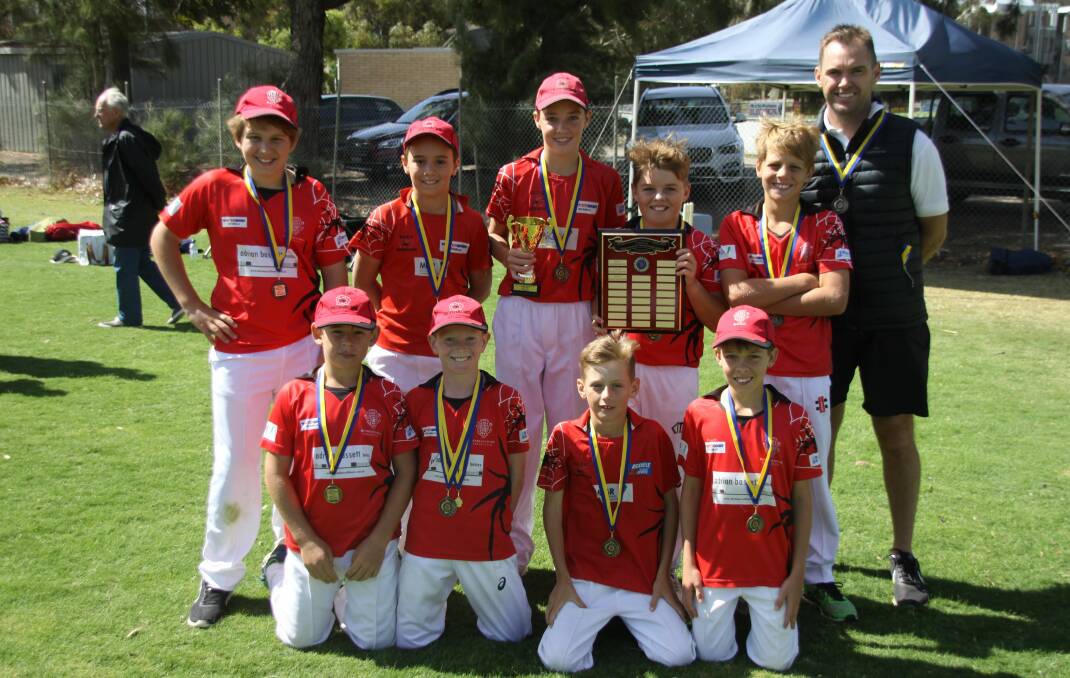 ALL SMILES: Bendigo United's under-12A premiership team after its grand final victory. Picture: BDCA