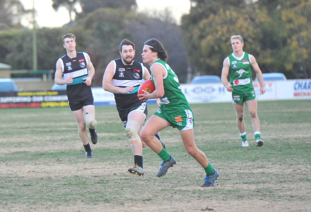 ON DEBUT: Kangaroo Flat's Kyle Symons shows some dash down the wing in the Roos' seven-goal win over Maryborough at Dower Park. Picture: ADAM BOURKE