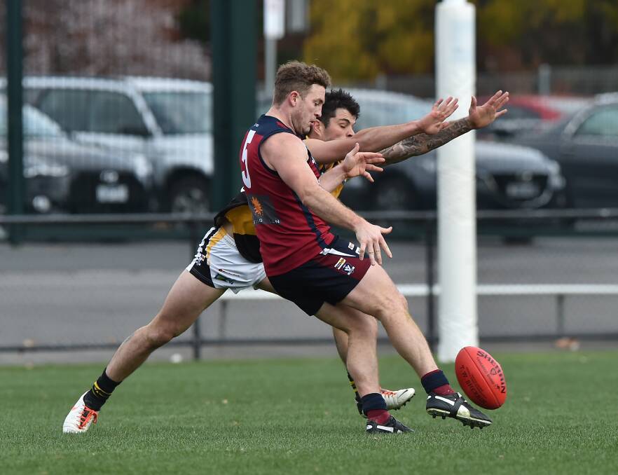 BEST ON GROUND: Sandhurst's Kristan Height gets a kick away in the final round match with Kyneton at the QEO. Picture: NONI HYETT