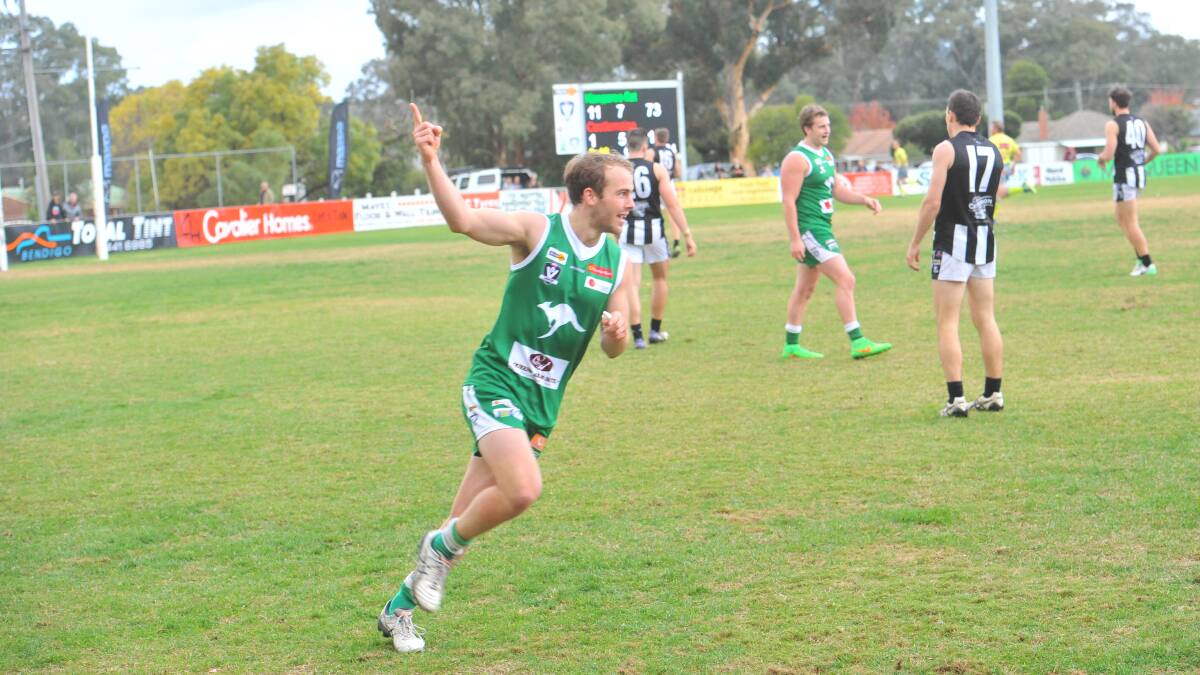 UP AND ABOUT: Kangaroo Flat co-coach Corey Greer celebrates one of his four goals against Castlemaine. Picture: LUKE WEST