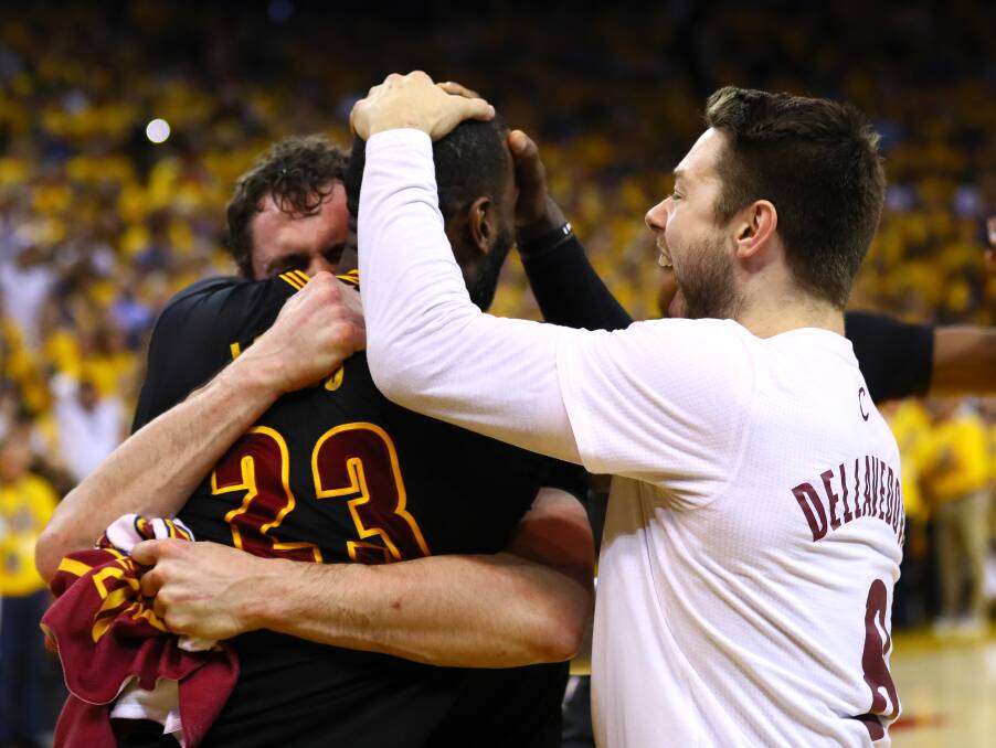 HISTORY: Dellavedova was one of the first players to embrace LeBron James after the Cavs won the NBA Finals. Picture: GETTY IMAGES