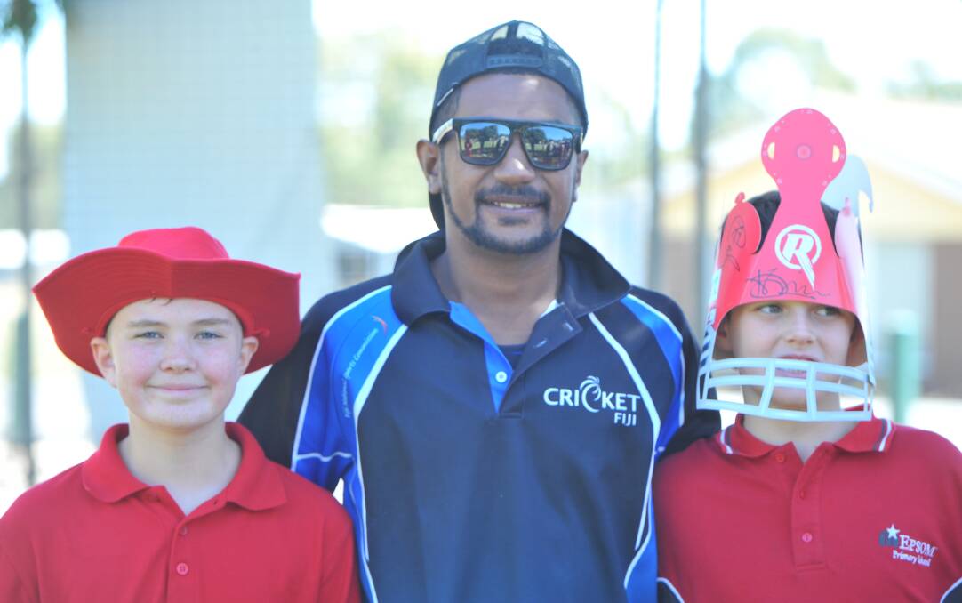 LEARNING SKILLS: Epsom Primary School students Owen Jones and Harry King with Fijian cricketer Viliame Yabaki.