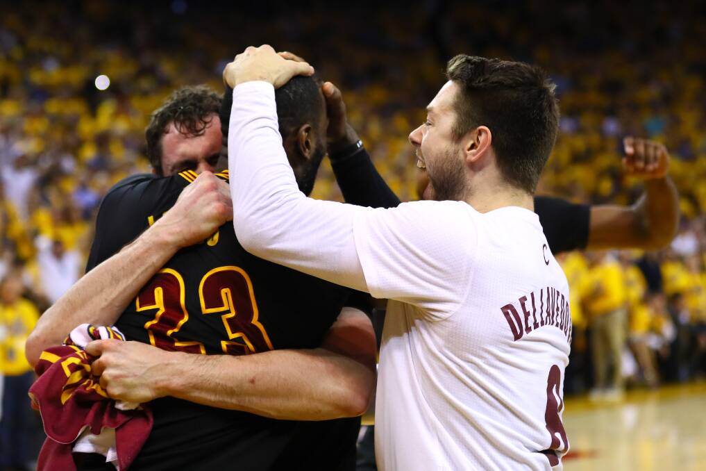 Delly embraces LeBron James after the Cavs won the NBA title. Picture: GETTY IMAGES