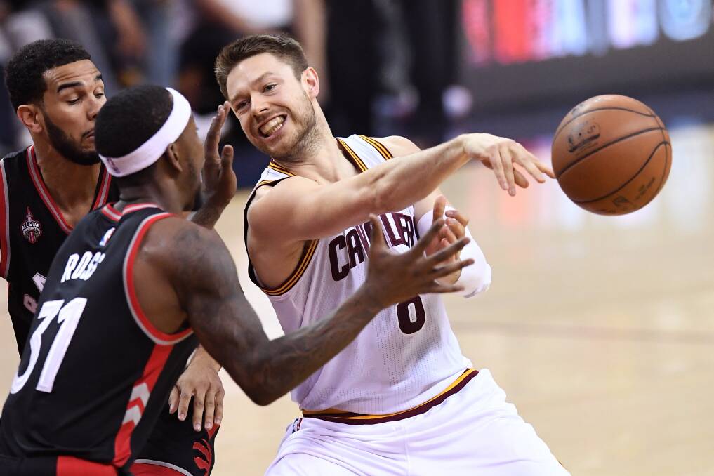 Matthew Dellavedova delivers one of his five assists in Cleveland's game five thrashing of Toronto. Picture: GETTY IMAGES