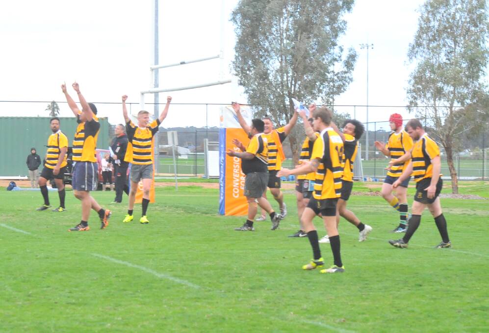 ELATED: The Bendigo Fighting Miners celebrate their win after the final whistle.
