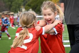 Junior soccer is all about having fun - just ask these Spring Gully under-6 team-mates.