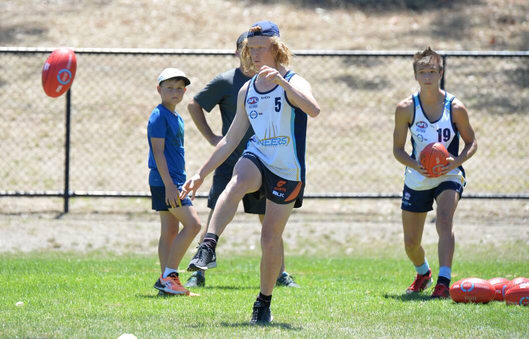 Billy Robertson takes part in the kicking test at Pioneers training. Picture: GLENN DANIELS
