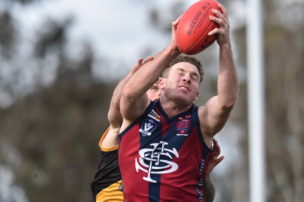Kristan Height marks for Sandhurst in its win over Kyneton on Saturday. Picture: NONI HYETT