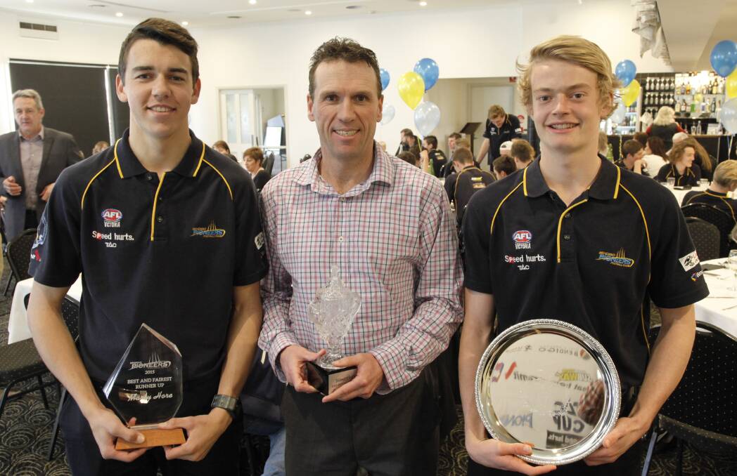 PROUD PIONEERS: Coach Brett Henderson with best and fairest runner-up Marty Hore, left, and best and fairest winner Lachlan Tardrew, right. Picture: PETER KRUTOP