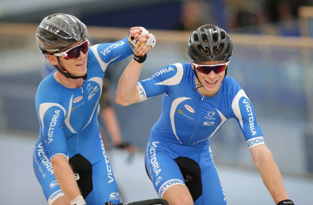 Isaac Buckell, right, celebrates his gold medal ride in the national under-19 madison with team-mate Godfrey Slattery. Picture: JOHN VEAGE