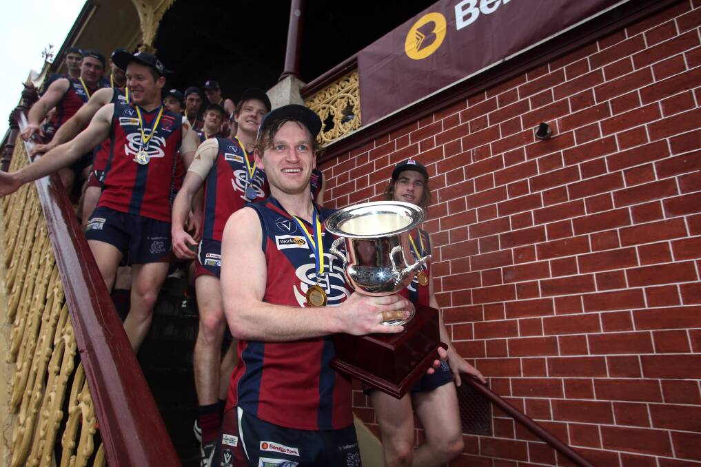 PREMIERSHIP STAR: Nick Stagg leads his Sandhurst team-mates down the QEO grandstand stairs after they claimed the Bendigo Advertiser Cup. Picture:  GLENN DANIELS