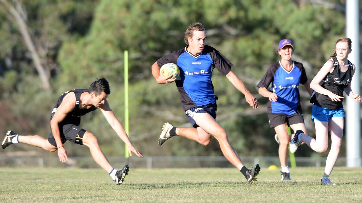 Action from last year's touch footy grand final.