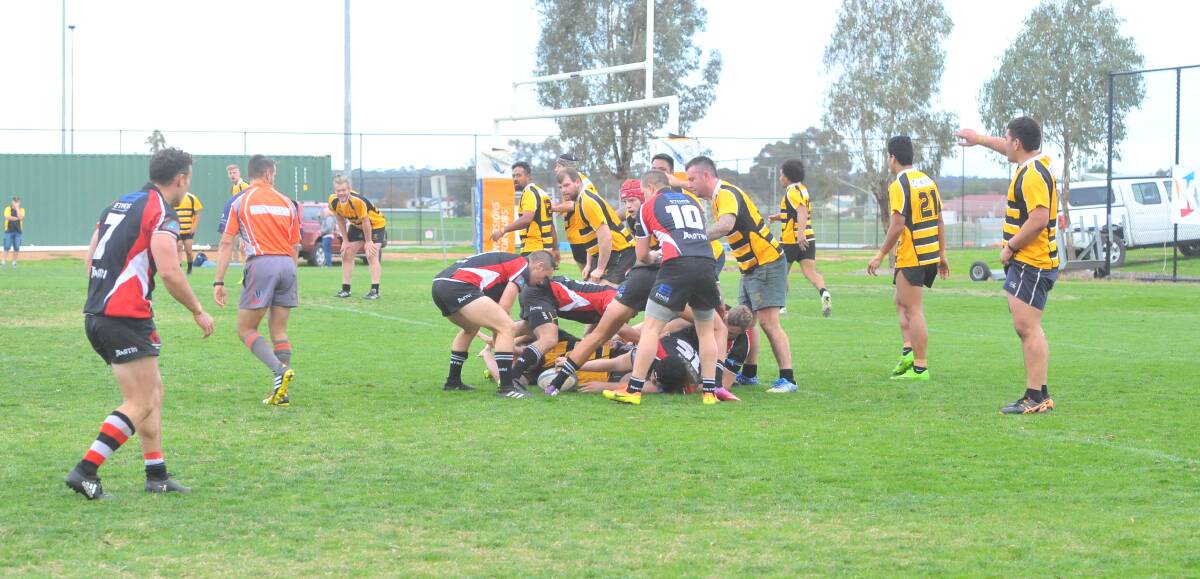 GUTSY STUFF: The Bendigo Fighting Miners defensive line tries to keep the Kiwi Hawthorn forwards from scoring. Picture: ADAM BOURKE