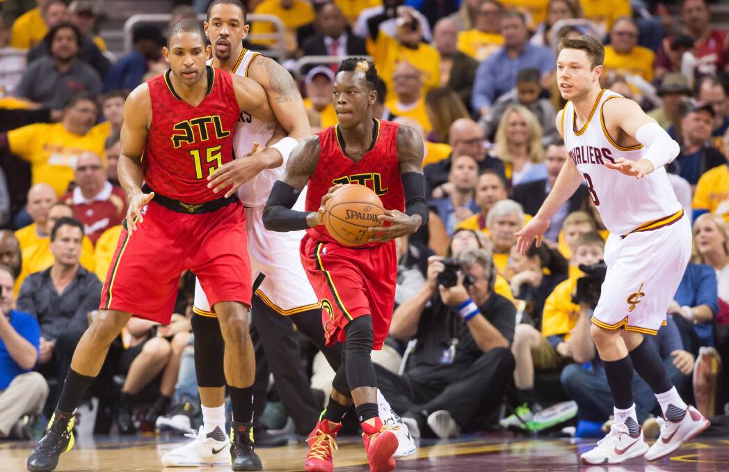 DEFENCE: Cleveland's Matthew Dellavedova looks to stop Atlanta Hawks guard Dennis Schroder. Picture: GETTY IMAGES