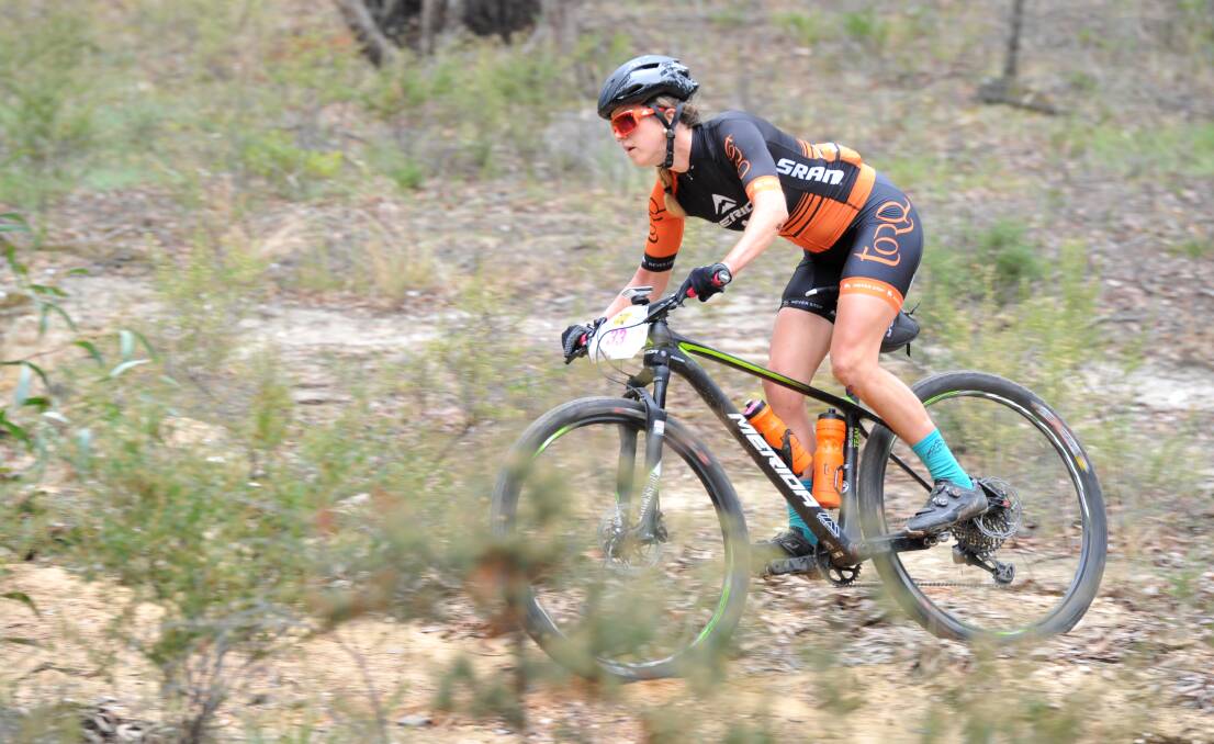 ROUGH TERRAIN: Katherine McInerney competes in the 100km women's race.
