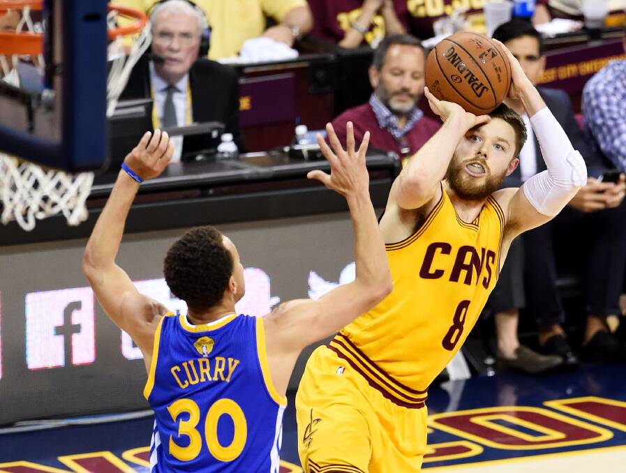 Matthew Dellavedova shoots over Steph Curry in the NBA Finals.
