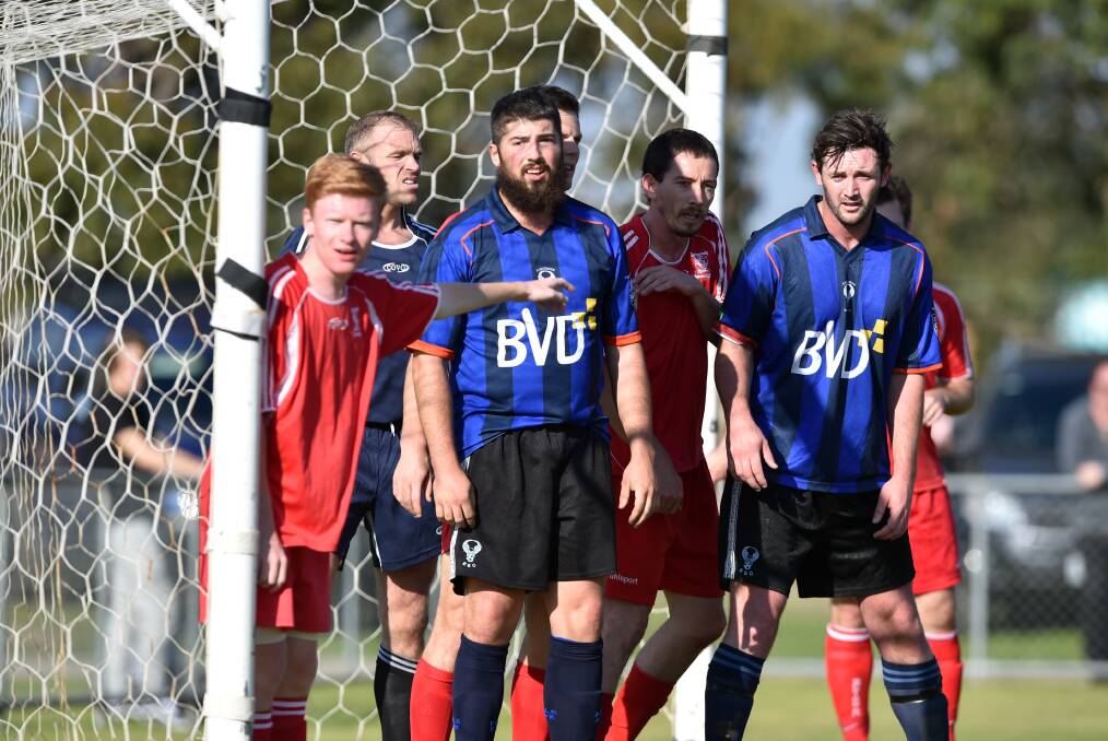 Spring Gully and Epsom players wait for a corner kick in Sunday's game at Truscott Reserve. Picture: GLENN DANIELS
