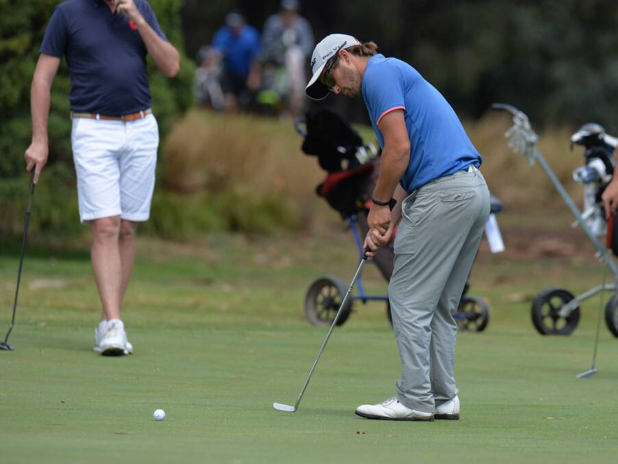 MIXED DAY: Kris Mueck putts for birdie on the 18th hole at Neangar Park.