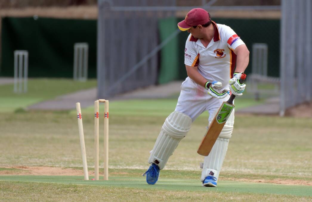 Maiden Gully's Greg Burns looks back to find his off stump pushed back after be was bowled against Mandurang. Picture: GLENN DANIELS