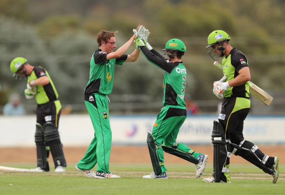 Liam Bowe celebrates his wicket with Melbourne Stars keeper Sam Harper. Picture: GETTY IMAGES