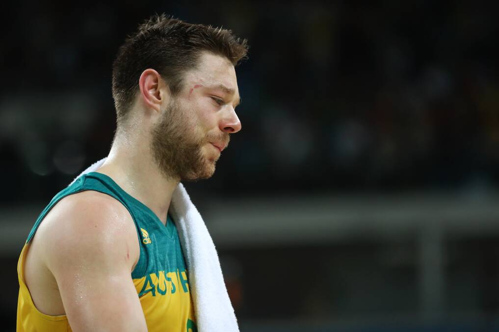 An emotional Matthew Dellavedova leaves the court after the loss to Spain. Picture: GETTY IMAGES