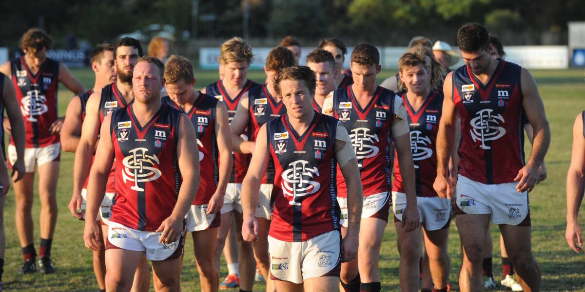 Sandhurst players trudge off the ground after the round one loss to Strathfieldsaye.