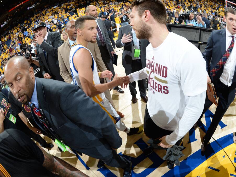 BAD LUCK, BUD: Dellavedova shakes hands with Steph Curry after the Cavaliers' triumph. Picture: GETTY IMAGES