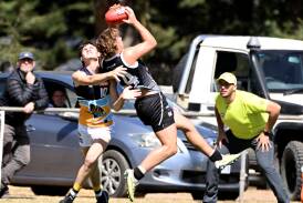 Bendigo Pioneers' defender Nick Thompson tries to stop Rebels' forward Strahan Robinson. Picture by Ballarat Courier