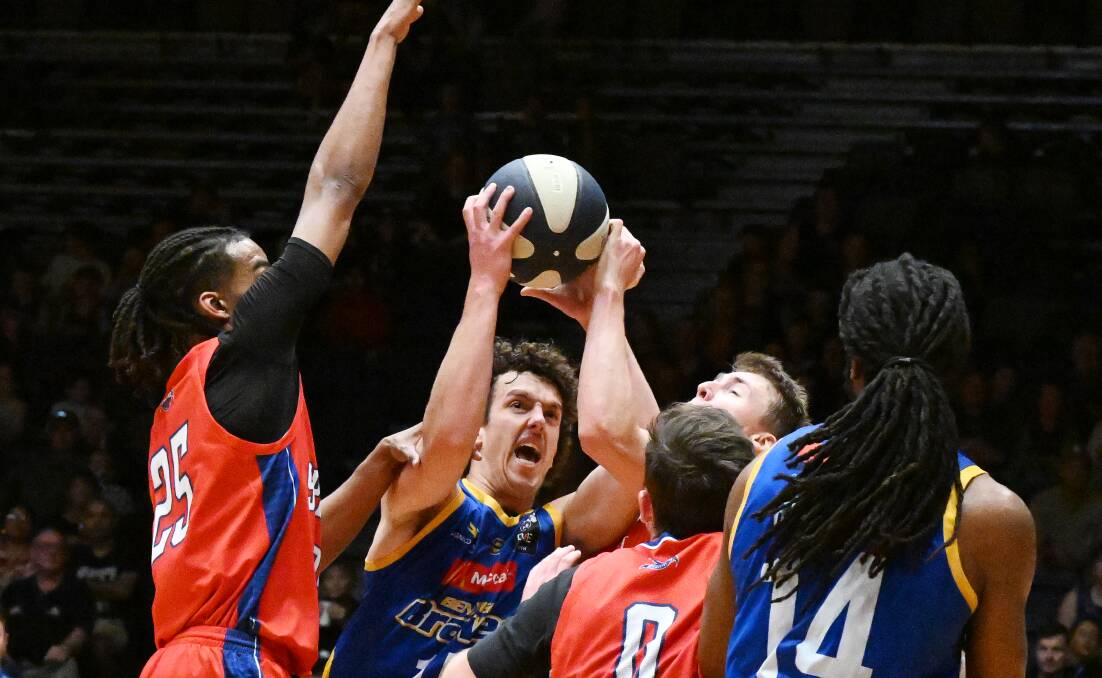 Bendigo's Isaac Murphy tries to score against Nunawading. Picture by Darren Howe