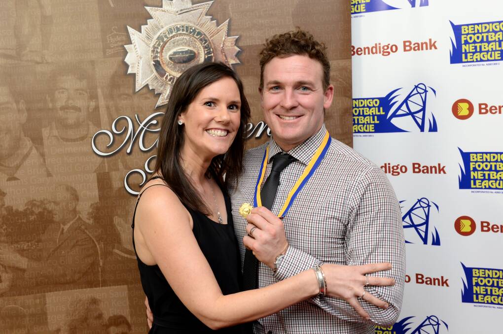 Sandhurst's Kristan Height with his wife Melissa after his Michelsen Medal triumph. Picture: DARREN HOWE