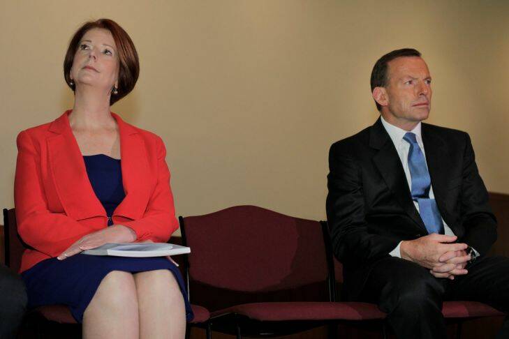 Prime Minister Julia Gillard and Opposition Leader Tony abbott sat together at a Fred Hollows Foundation event at Parliament House Canberra on Thursday 23 August 2012. Photo: Andrew Meares Photo: Andrew Meares