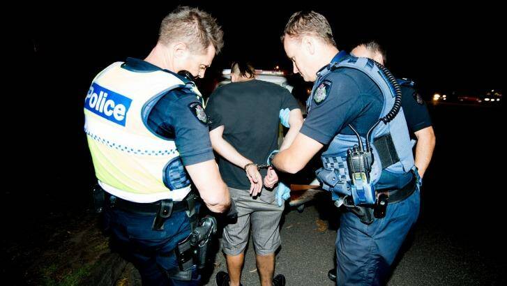 A man arrested in a family violence call out. Photo: Penny Stephens