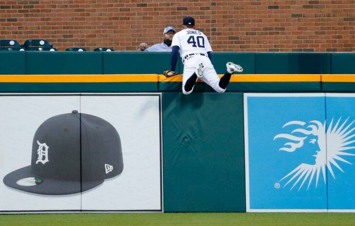 Detroit Tigers center fielder JaCoby Jones (40) watches a Kansas City Royals' Salvador Perez solo home run over the fence in the second inning of a baseball game in Detroit, Wednesday, Sept. 6, 2017. (AP Photo/Paul Sancya)