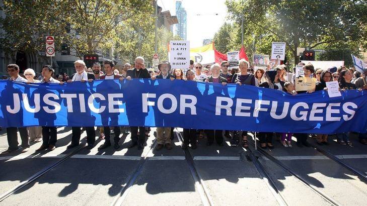 Protesters march down Swanston Street. Photo: Graham Denholm