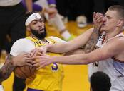 Anthony Davis (l) must contain Nikola Jokic (r) as the Lakers and Nuggets meet in the NBA playoffs. (AP PHOTO)