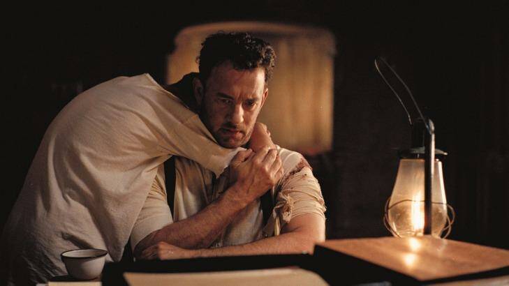 Tom Hanks says very little as a man trying to avenge the murder of his family and protect his son played by Tyler Hoechlin in Sam Mendes' film <i>Road To Perdition</i>. Photo: Supplied