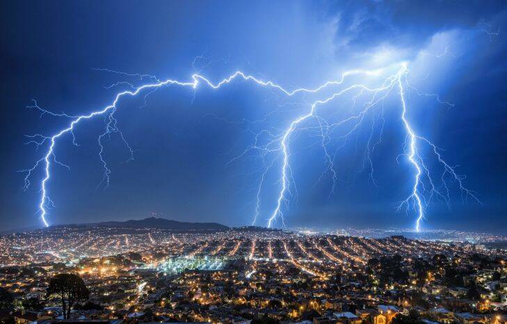 In this Monday Sept. 11, 2017 photo provided by Hardik Desai, lightning illuminates the sky over San Francisco as a thunderstorm passes. Thunderstorms are expected to sweep through Northern California on Tuesday, Sept. 12, 2017, a day after rain, thunder and lightning delayed dozens of flights and stalled the start of a Giants-Dodgers game. (Hardik Desai/@eachplacearhapsody via AP)