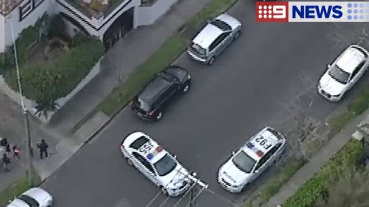 Police are negotiating with a man who has holed himself in a Toorak apartment. Photo: Channel Nine