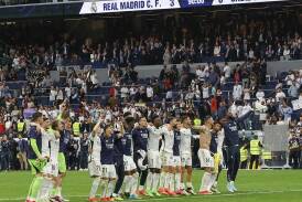 Real players applaud the fans after their defeat of Cadiz paved the way for another title triumph. (EPA PHOTO)